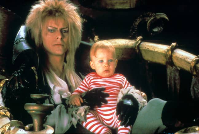 The Goblin King - played by the late David Bowie - steals baby Toby (Credit: TriStar Pictures)