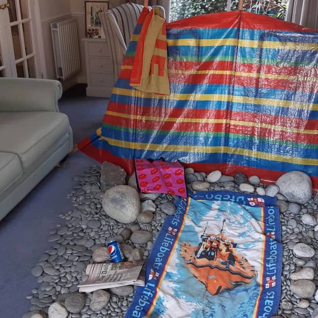Keith and Liz set the beach scene using fake stones and pebbles (Credit: Triangle News)