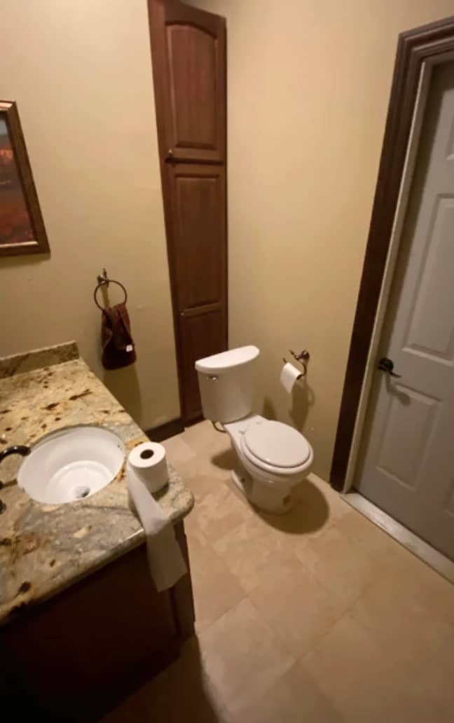 The toilet can be seen in front of the cupboard (Credit: Reddit)