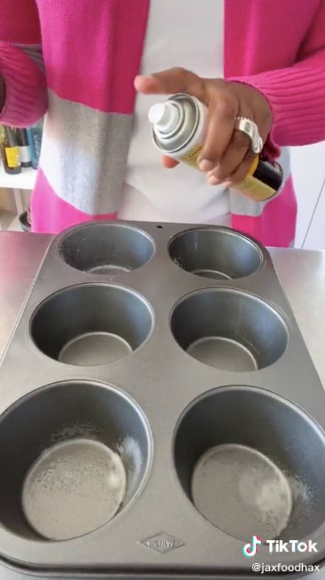 Grease the muffin tin compartments with a quick spritz of oil (Credit: TikTok / @JaxFoodHax)