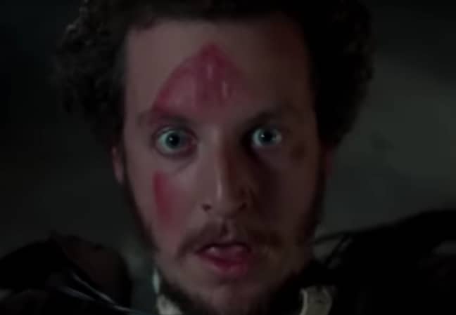 Marv gets whacked in the face with an iron in 'Home Alone'. (Credit: 20th Century Fox)