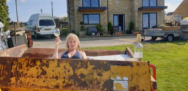 After they let the sun heat up the water, Helen got in the digger to enjoy a soak (Credit: Kennedy News)
