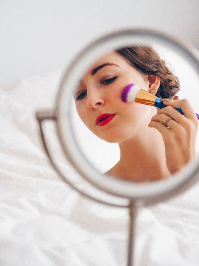 A new study has claimed that women who wear a lot of makeup are seen to be less intelligent (Credit: Unsplash)