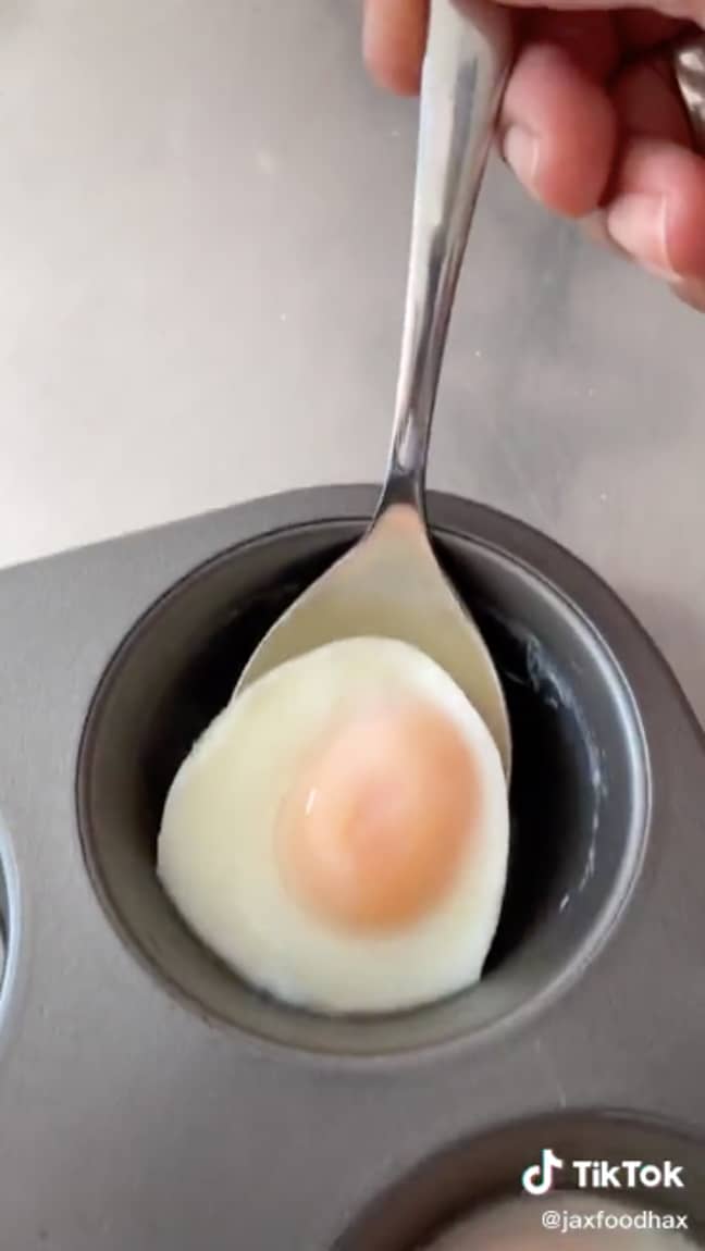 Voila! A perfectly poached egg - and no time spent sweating over a pan of hot water (Credit: TikTok / @JaxFoodHax)