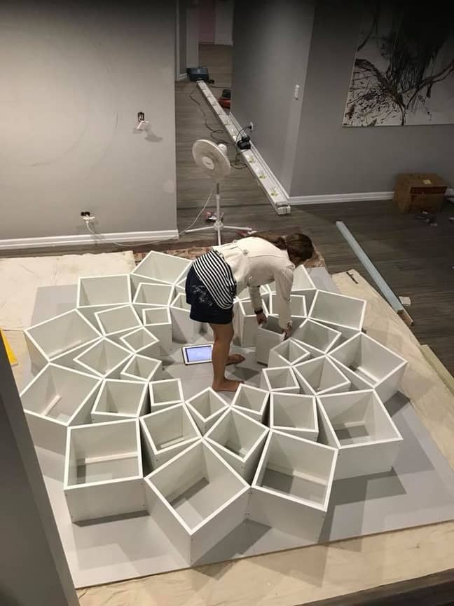 Once the boxes were drilled together, they mocked the bookcase up on the floor, to check it all worked (Credit: Jessica Breen/Facebook)