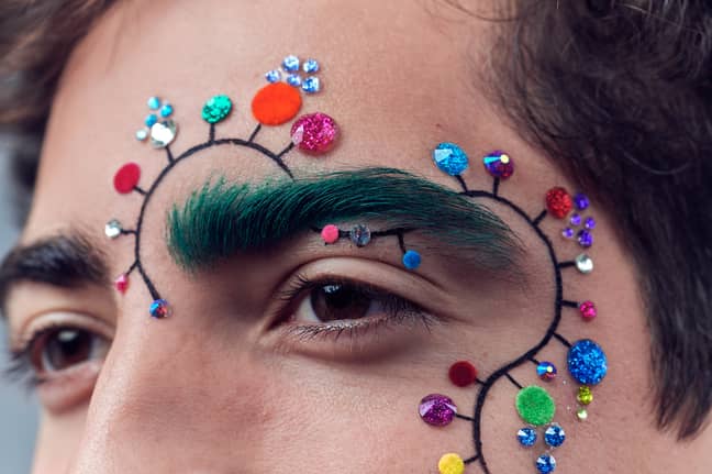 The trend features stick-on gems and plenty of glitter adornment (Credit: East Village Christmas Brow Bar)