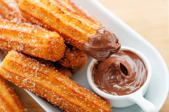 Churros are often served with chocolate dipping sauce (Credit: Shutterstock)