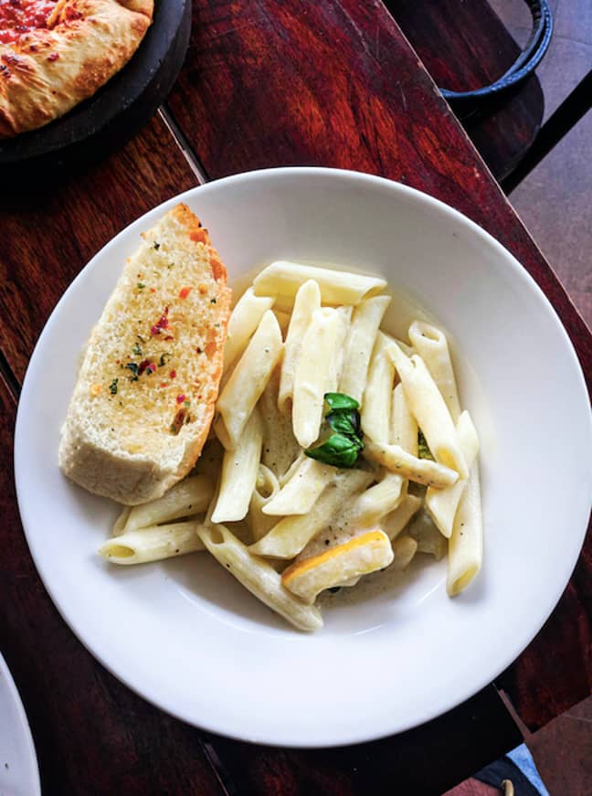 Pasta without a side of garlic bread is criminal in our opinion (Credit: Unsplash)