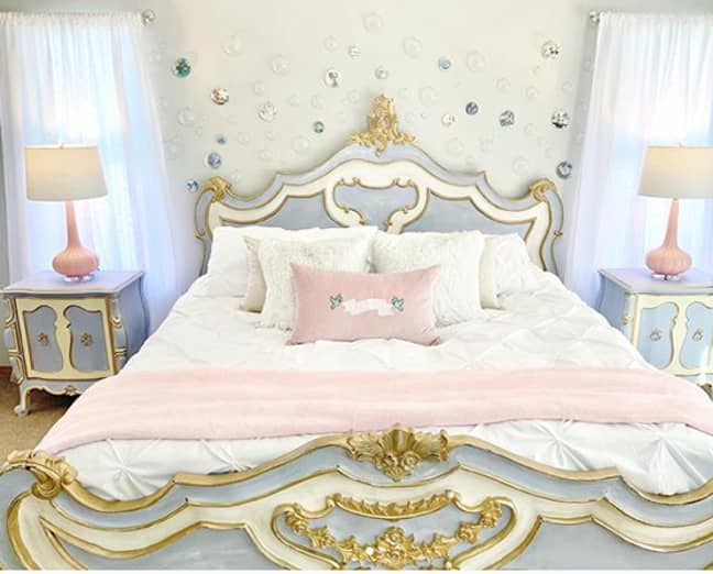 The 'Cinderella' bedroom features a royal bed frame and matching bedside tables (Credit: Instagram/kelseymichelle85)