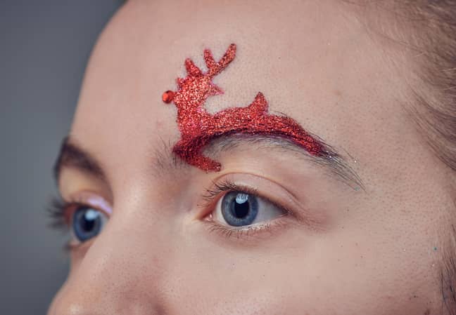 Try decking out your brows with a leaping red Rudolph designs or iridescent bow of holly (Credit: East Village Christmas Brow Bar)