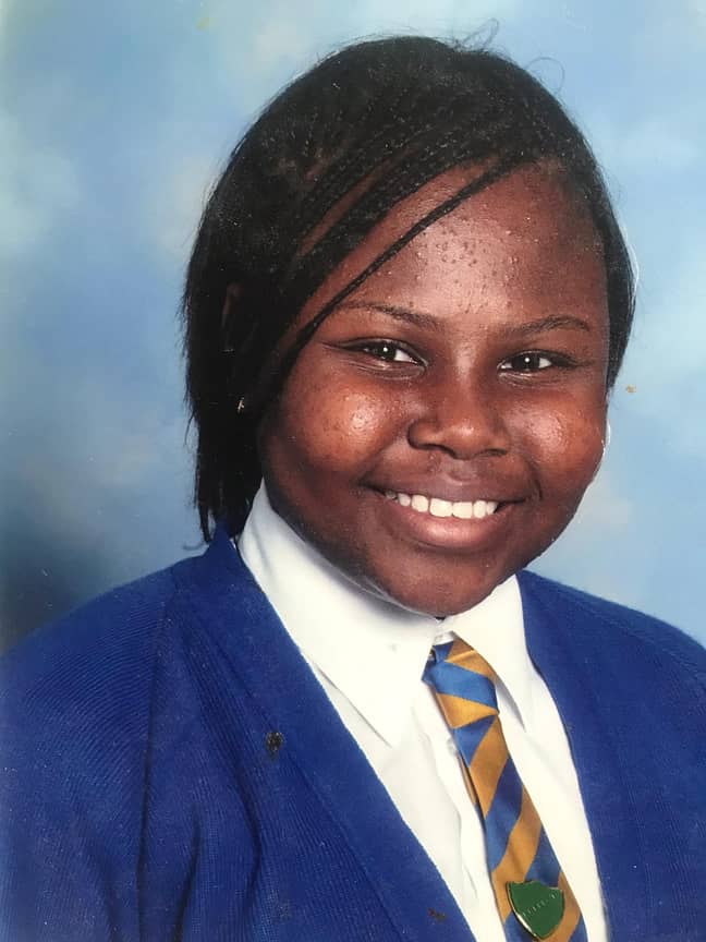 Nikki in Year 6 wearing her natural hair in braids. Growing up she was desperate for her curls to be 'straight and slick' (Credit: Nikki Onafuye)