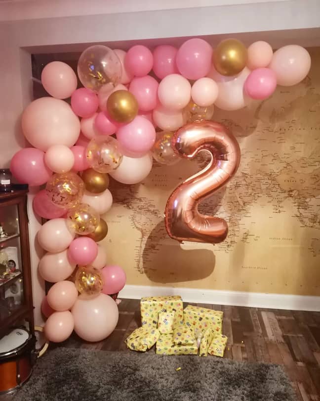 Molly's balloon arch in pink and gold took 2 hours to assemble and looks spectacular! (Credit: Molly Coleborn)