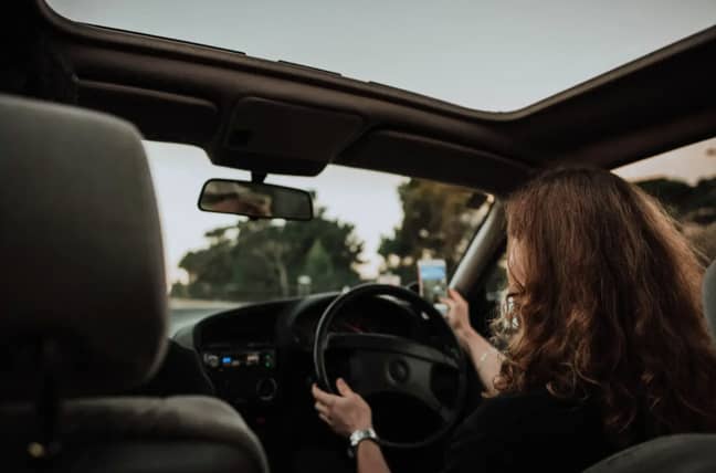 A loophole previously let drivers take pictures or videos while they were driving (Credit: Unsplash)